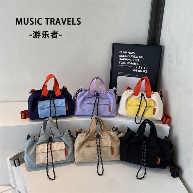 游樂者時尚撞色抽繩手提水桶包(預購)